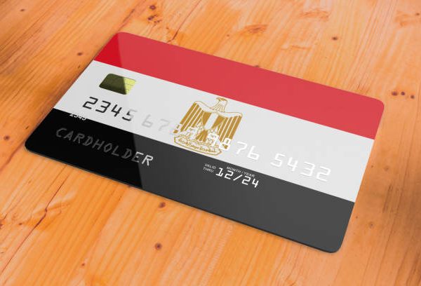istockphoto-1341714179-612x612 Plastic credit or bank debit card with country flag of Egypt national banking system isolated on wooden table close up concept 3d rendering image